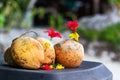 Three coconuts on a table outdoors in Praslin, Seychelles Royalty Free Stock Photo