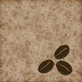 Three coffee beans on light brown background