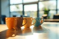 Three coffee cups lined up on table Royalty Free Stock Photo