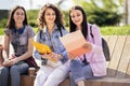 Three collage girls studying outside Royalty Free Stock Photo