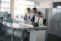 Three colleague in office using computer Business people in offi