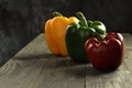 Bell peppers tricolor, dark background on black table Royalty Free Stock Photo