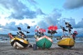 Three color boats an sea coast before the storm Royalty Free Stock Photo