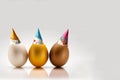 three color eggs with bithday hat Royalty Free Stock Photo