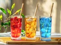 Three color fresh drink in tall glass with bamboo straw