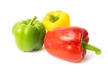 Three colored bell peppers on a white background Royalty Free Stock Photo