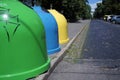 Three colored bins for sorting waste located in the city on the street.Trash Containers for Garbage Separation -- three colors for Royalty Free Stock Photo