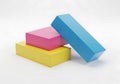 Three colored cubes stacked together isolated on white background Royalty Free Stock Photo