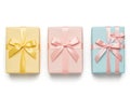 Three colored gift boxes with bows isolated on white background Royalty Free Stock Photo
