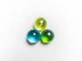 Three colored glass balls with caustics on a white background Royalty Free Stock Photo