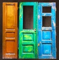 Three colored old wooden doors Royalty Free Stock Photo