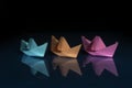 Three colored paper boats Royalty Free Stock Photo