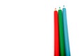 Three colored pencils. The colors red, green and blue. The concept of polygraphy and digital RGB color transfer Royalty Free Stock Photo