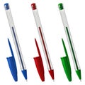 Three colored plastic ballpoint pens with caps, in a transparent hexagonal case