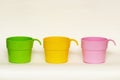 Three colored plastic cups Royalty Free Stock Photo