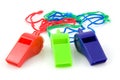 Three colored plastic whistles