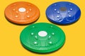 Three colored rotation discs for training the waist and strengthening the muscles of the back, concept