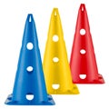 Three colored sports or road cones, blue, yellow and red, stand on a white background Royalty Free Stock Photo