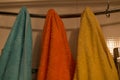 Colorful towels hanging on hooks Royalty Free Stock Photo
