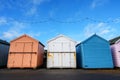 Three colorful beach huts in Felixstowe, UK. Royalty Free Stock Photo