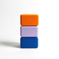 Three colorful blocks stacked vertically against a white background Royalty Free Stock Photo