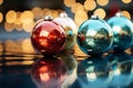 three colorful christmas ornaments on a shiny surface Royalty Free Stock Photo