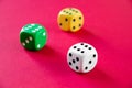Three colorful dices isolated on pink Royalty Free Stock Photo