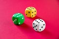 Three colorful dices isolated on pink Royalty Free Stock Photo