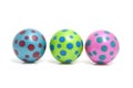 Three colorful dotted balls