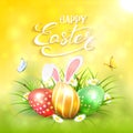 Yellow sunny background with Easter eggs and rabbit ears in grass Royalty Free Stock Photo
