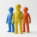 Three colorful figures blue yellow orange standing together symbolizing teamwork and unity Royalty Free Stock Photo
