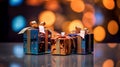 three colorful gift boxes on a table with bokeh lights in the background Royalty Free Stock Photo