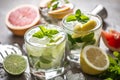 Three colorful gin tonic cocktails in whiskey glasses on bar counter in pup or restaurant