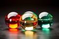 three colorful glass spheres on a black surface Royalty Free Stock Photo