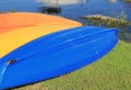 Three colorful kayaks drying out on beach Royalty Free Stock Photo