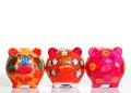 Three colorful piggy banks Royalty Free Stock Photo