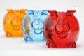 Three colorful piggy banks in a row Royalty Free Stock Photo