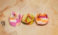 Three colorful ravioli on a wooden board