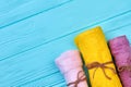 Three colorful rolled towels flat lay top view. Royalty Free Stock Photo