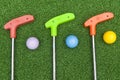 Three Mini Golf Clubs With Balls Royalty Free Stock Photo