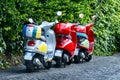 Three colorful scooters at the street, Rome, Italia Royalty Free Stock Photo