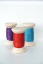 Three colorful spools thread