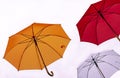 Three colorful umbrellas on a white background