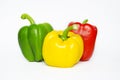 Three colors fresh sweet bell pepper or capsicum isolated on white background.Red,green,yellow.For decorate diet salad food or Royalty Free Stock Photo