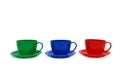 Three colour cups - toys on a white background