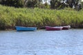 Three Colourful Canoes on the Lake