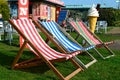 Three colourful deck chairs