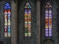 Three colourful stained-glass windows in church