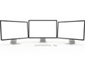 Three computer monitors isolated on white background Royalty Free Stock Photo