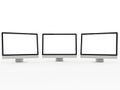 Three computer monitors isolated on white background Royalty Free Stock Photo